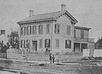  Lincoln in front of his Springfield home